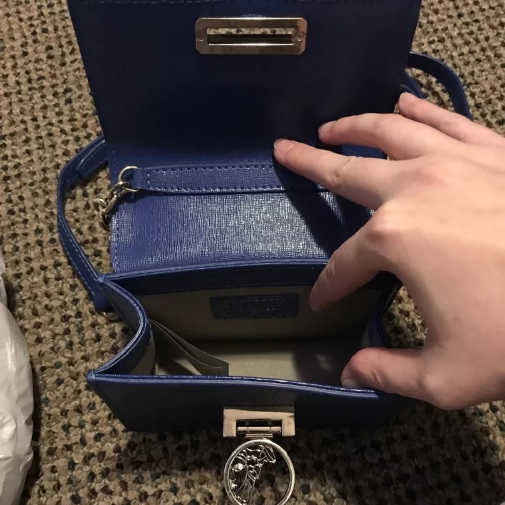 Blue Versace purse.